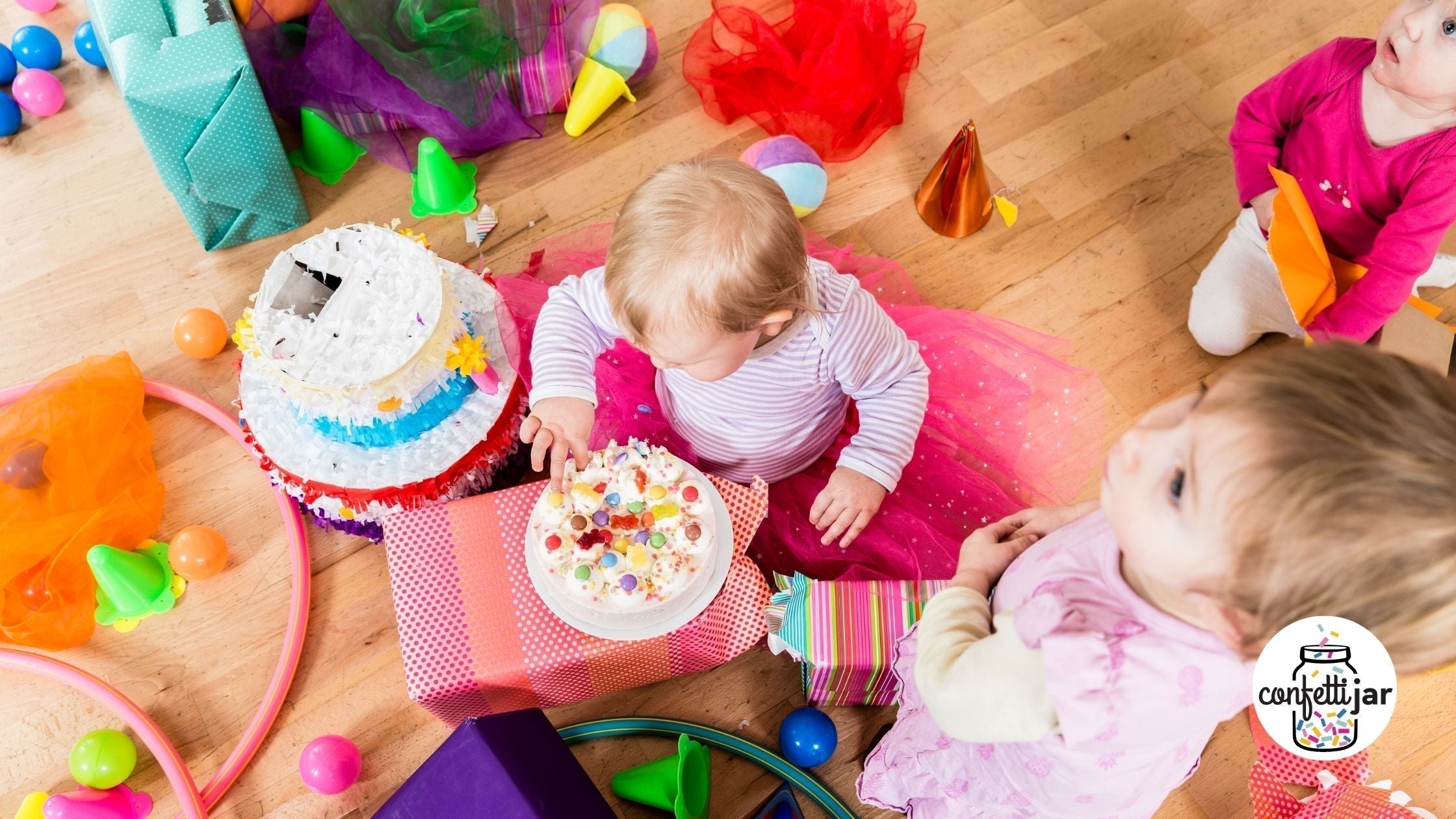 Toddler playing on a soft play set at an at-home first birthday party in Atlanta