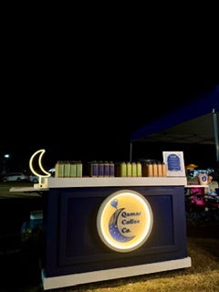 Coffee cart with a crescent moon symbol on a dark background