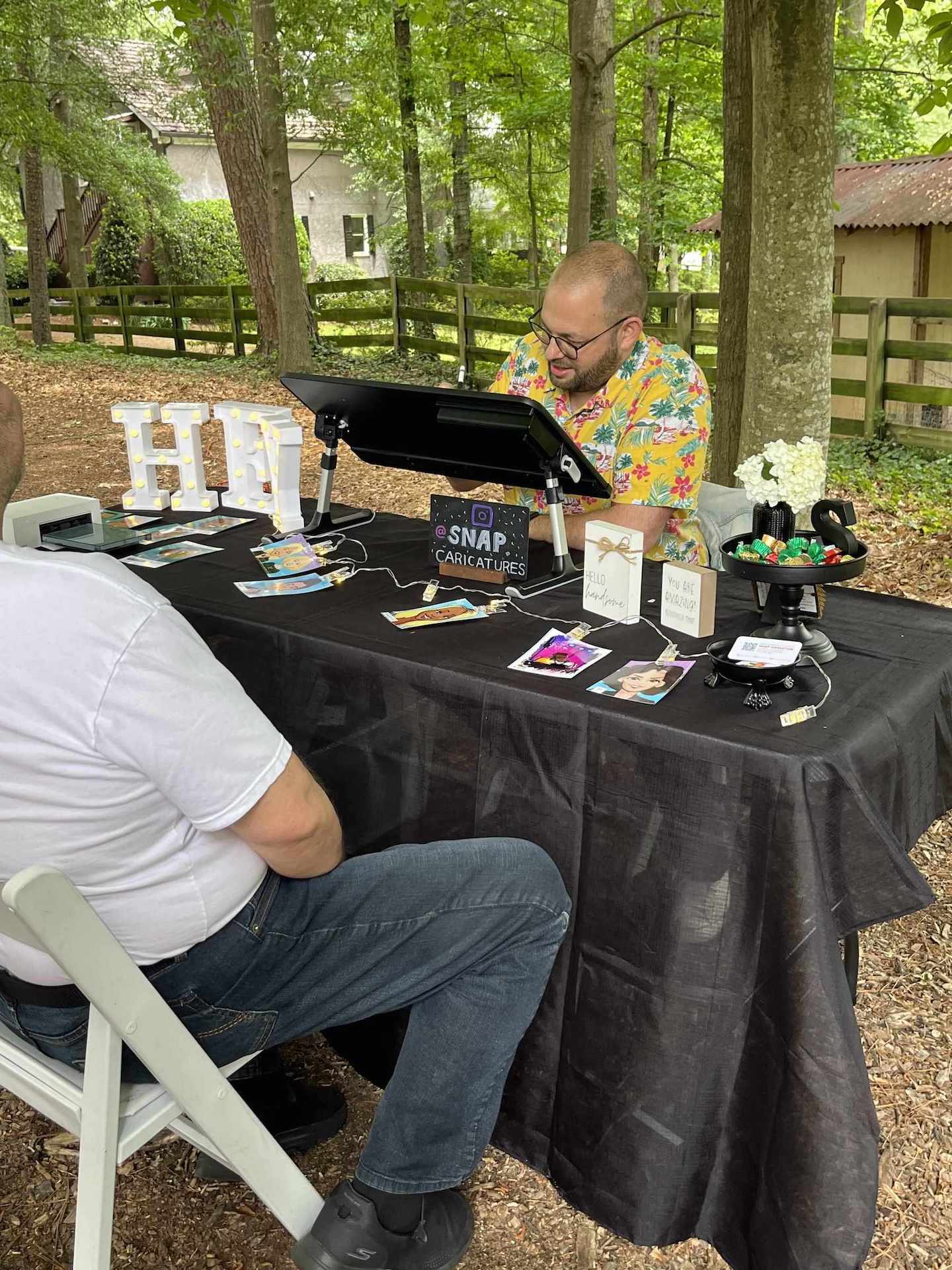 Man drawing digital caricatures in Atlanta.