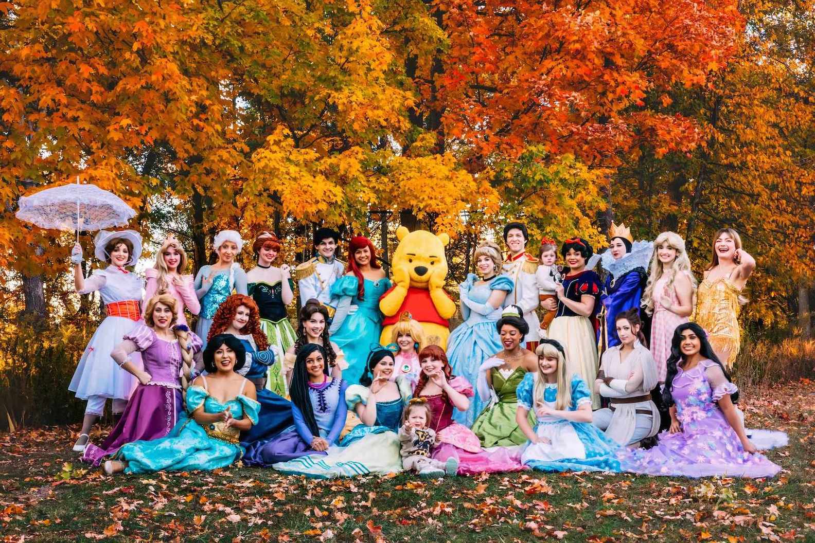 Birthday party characters including Winnie the Pooh and Elsa