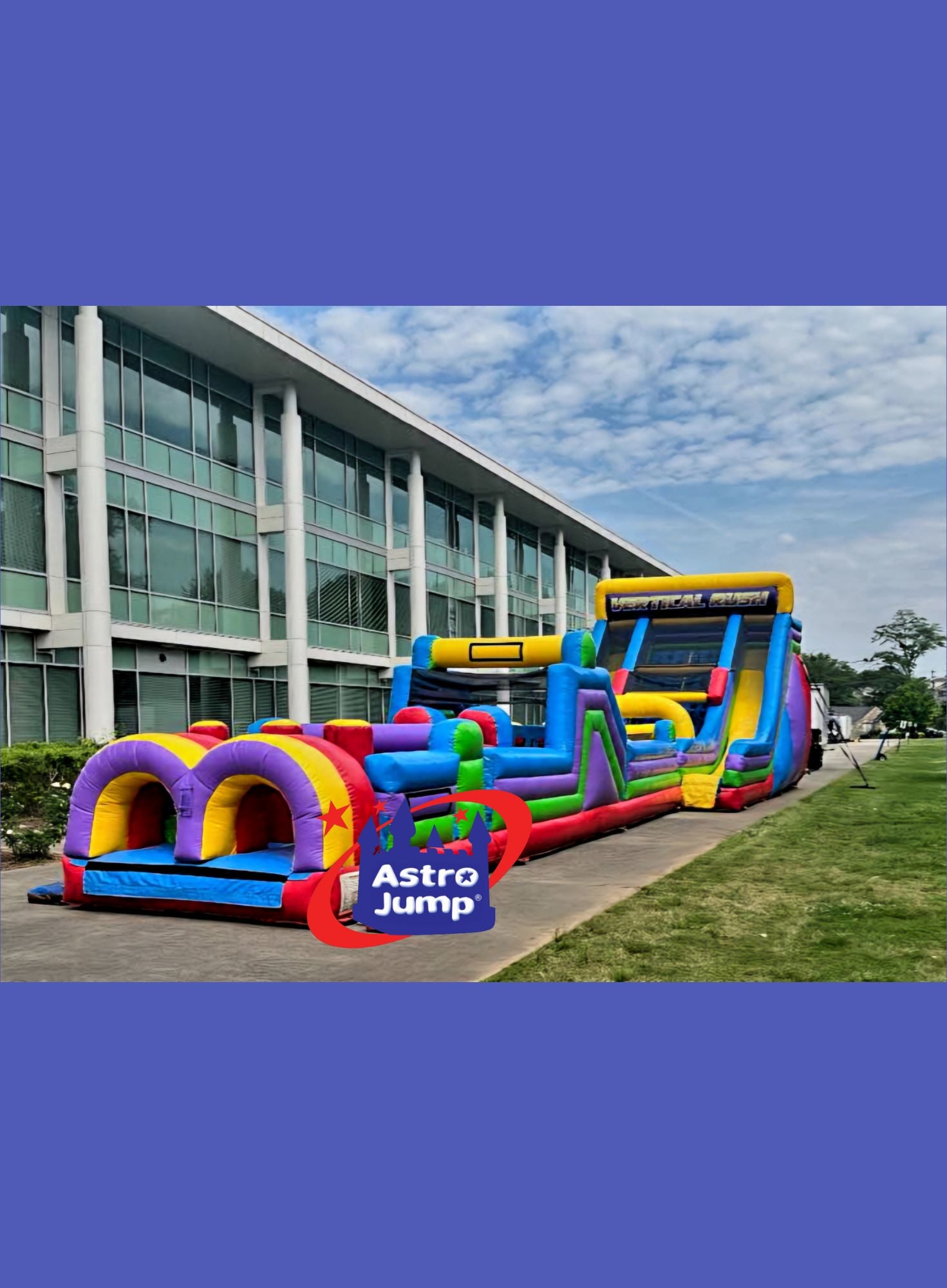 Colorful inflatable jumpers in front of a building with 'Astro Jump' branding.