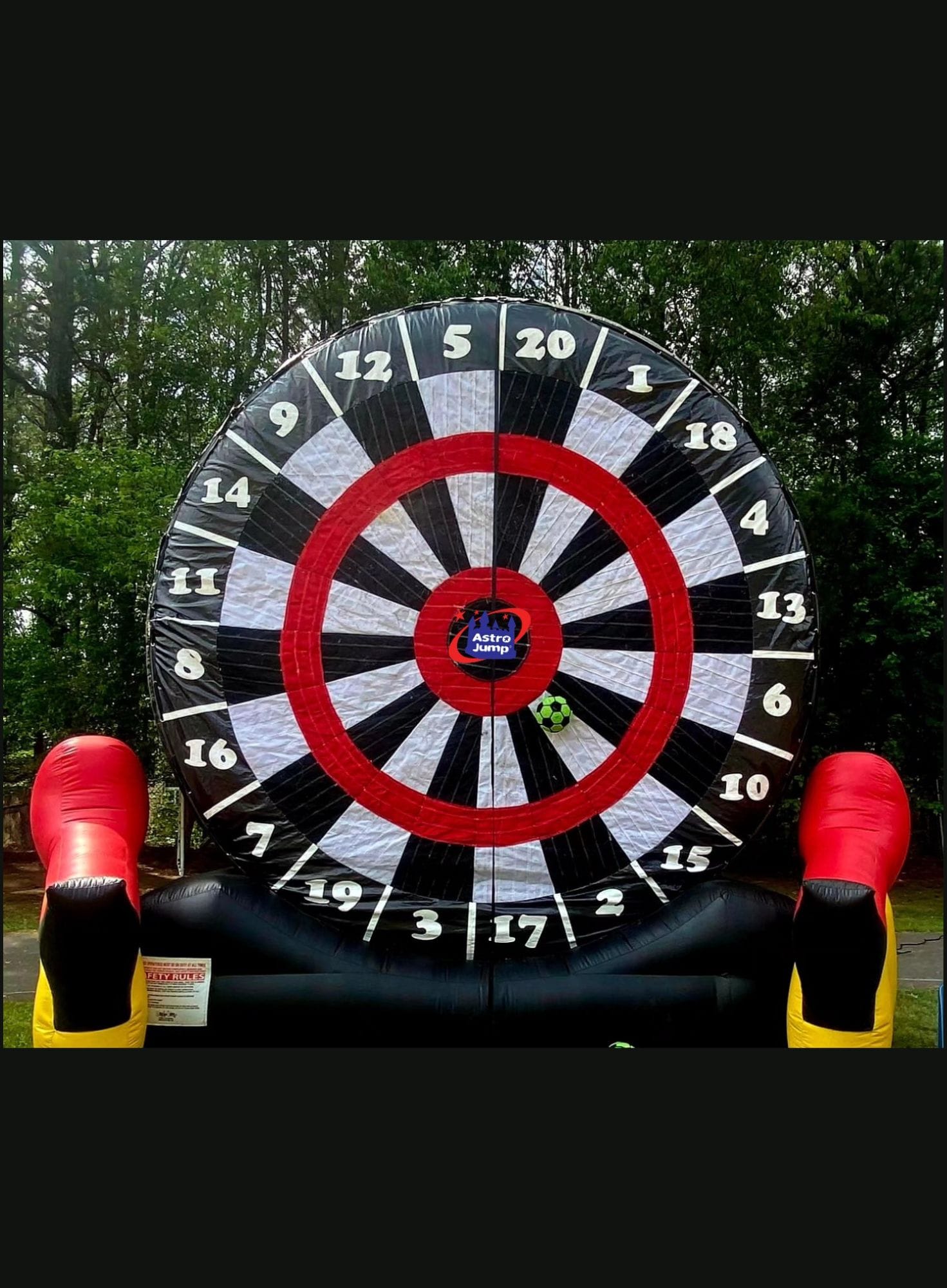 Inflatable soccer barts with red and black design outdoors