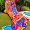 Colorful inflatable slide with pool at the bottom on a grassy area