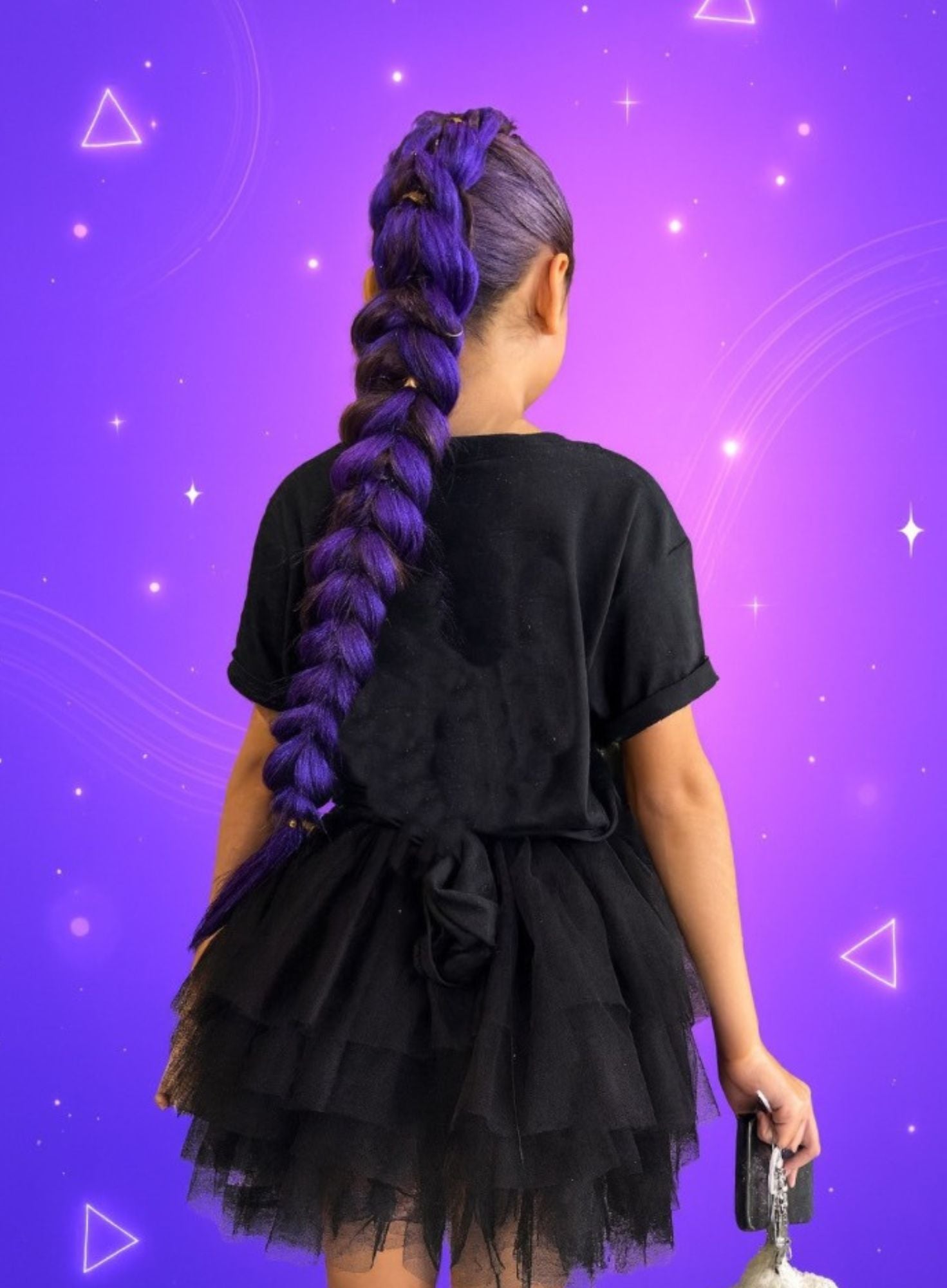 Person wearing a black outfit with a long purple braid against a purple geometric patterned background