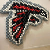 Atlanta Falcons logo made of colorful balloons on a white wall