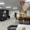 Modern office space with balloons on a table for a baby shower in Atlanta.