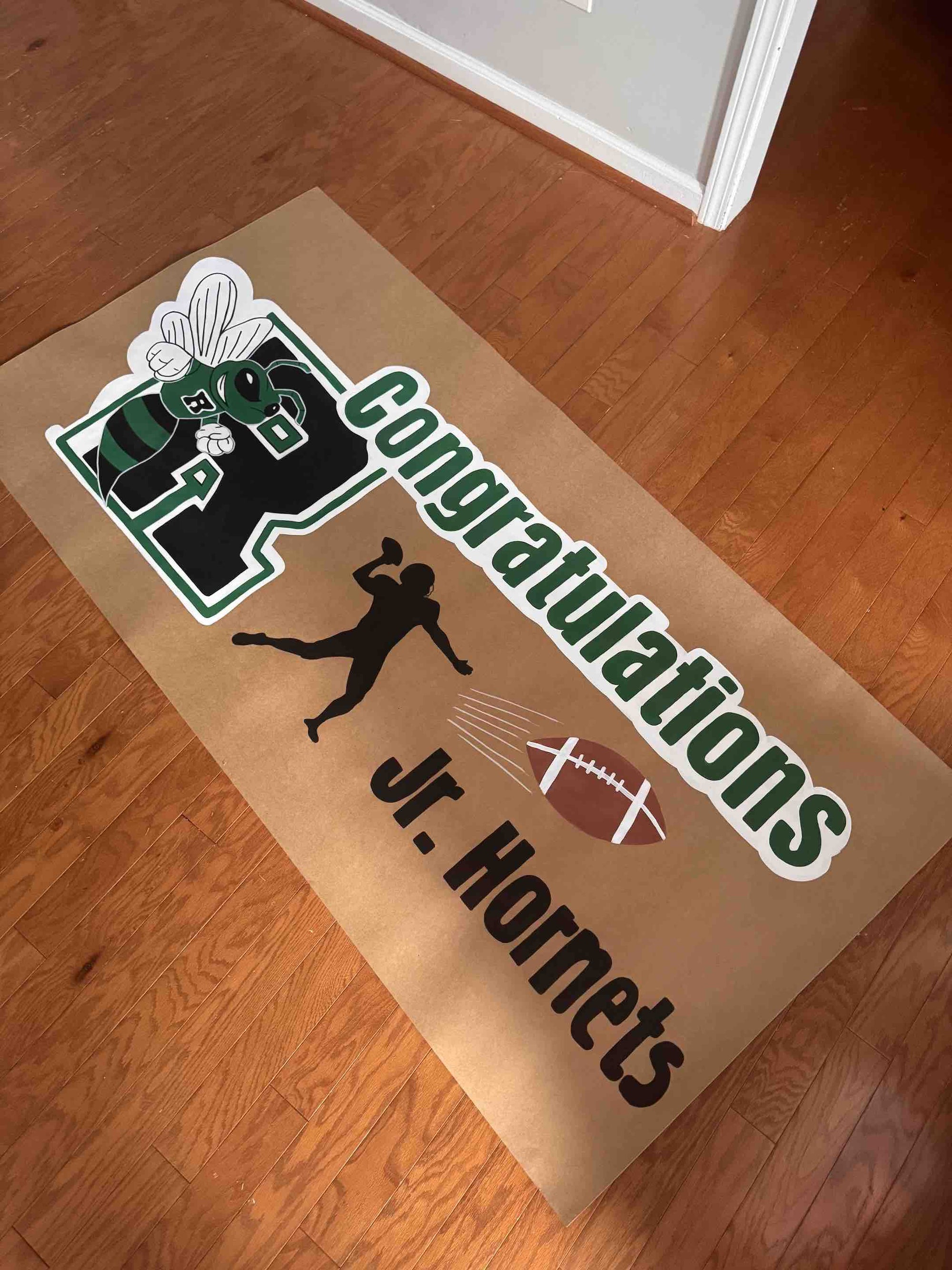 Custom hand-painted banner with football theme in Atlanta