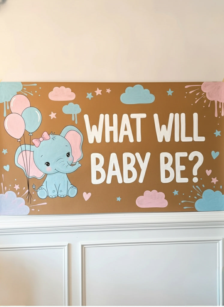 Custom hand-painted banner with an elephant and balloons on a brown background, featuring the text 'What Will Baby Be?'.