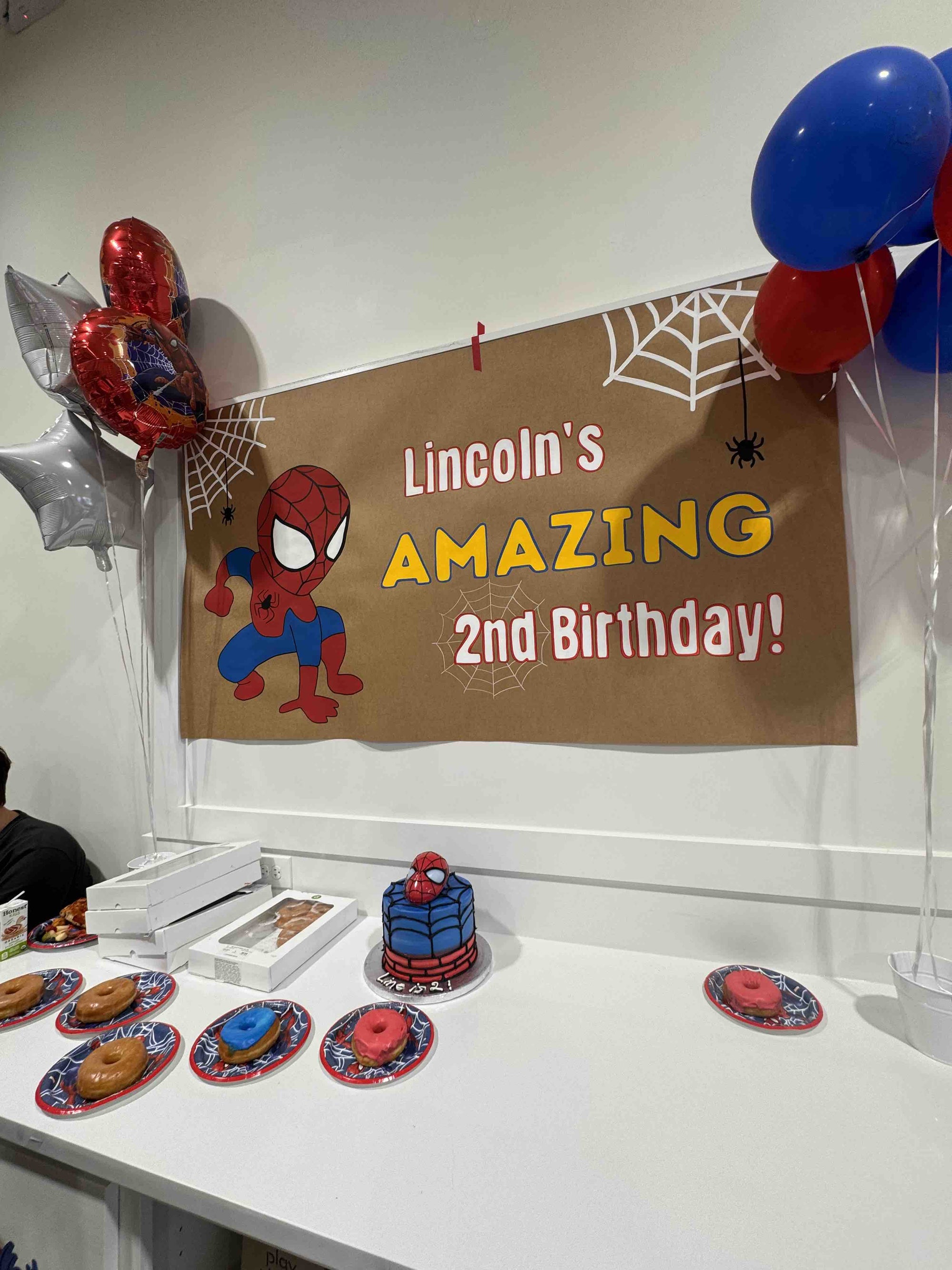 Custom hand-painted birthday party banner with Spiderman theme