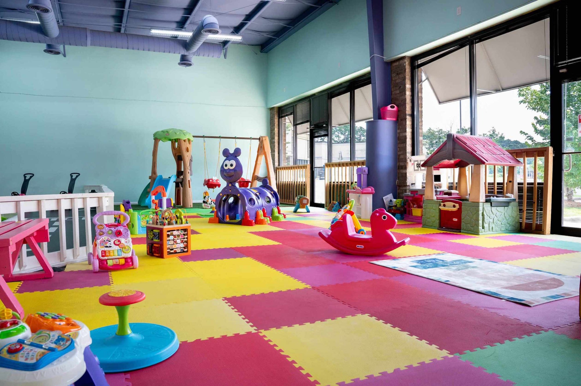 Colorful playroom with toys and children's furniture in Peachy Pals Playland Cartersville GA