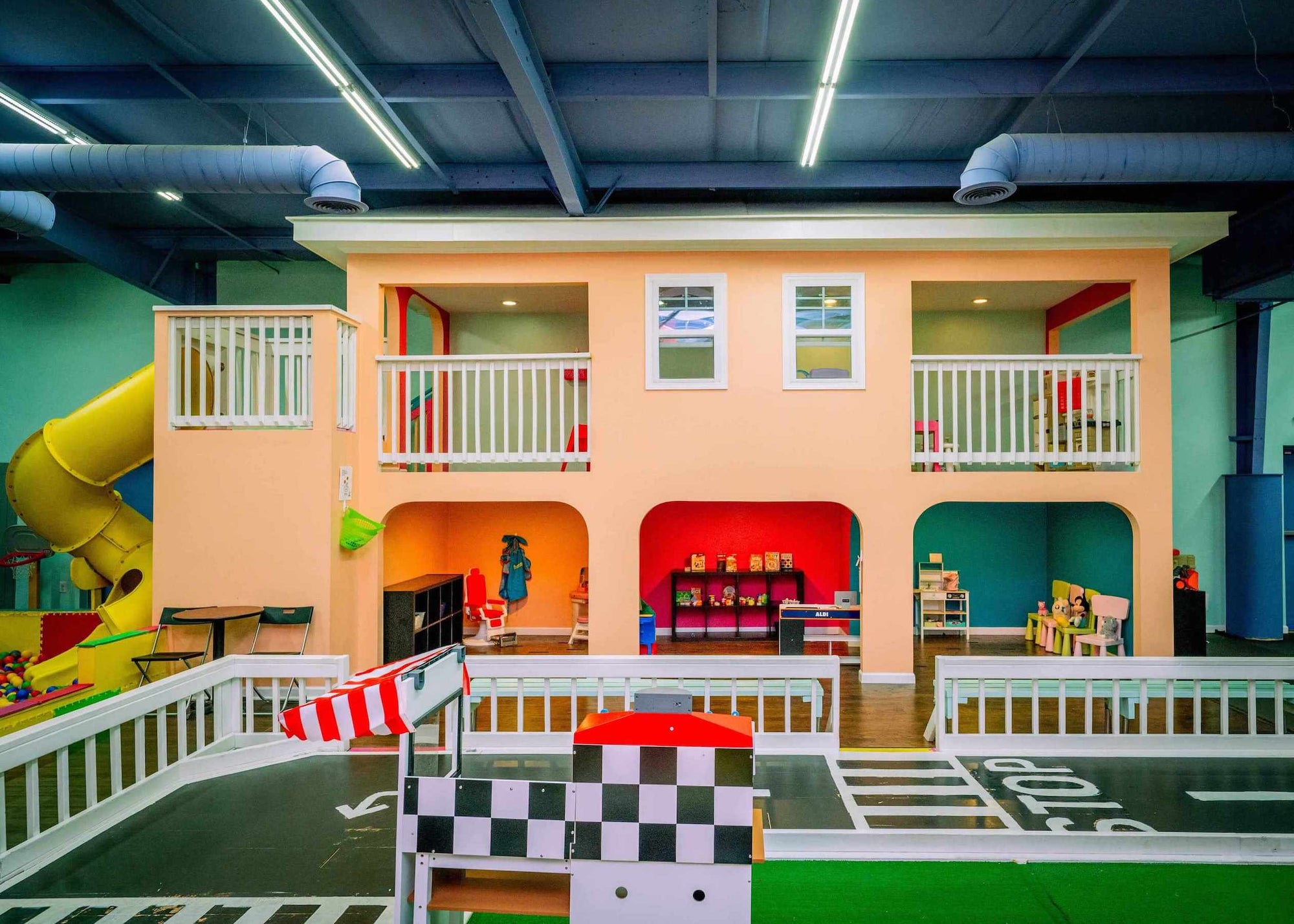 Colorful indoor play area with slides and toys at Peachy Pals Playland Cartersville GA | Confetti Jar