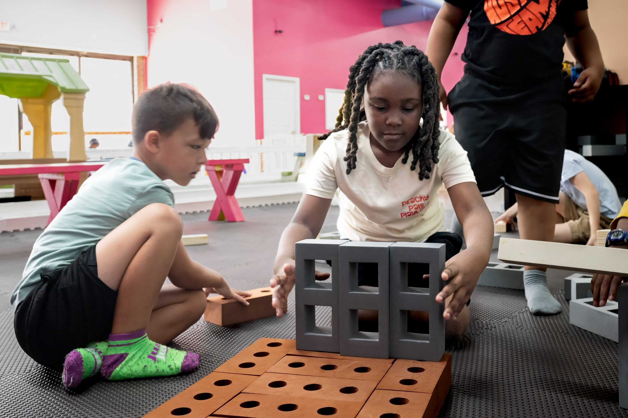 Children playing with building blocks at Peachy Pals Playland Cartersville GA | Confetti Jar