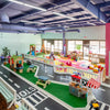 Children's playroom with toy cars, road signs, and colorful furniture at Peachy Pals Playland Cartersville GA | Confetti Jar