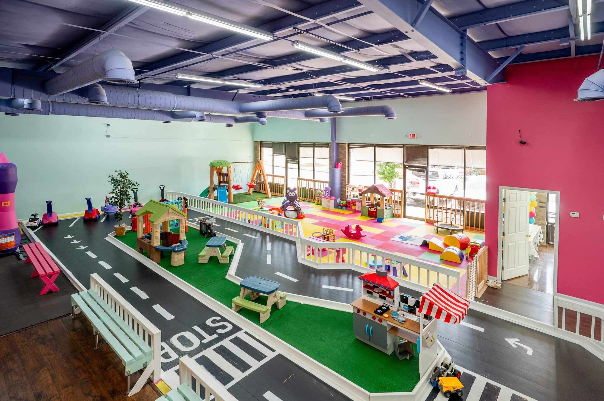 Children's playroom with toy cars, road signs, and colorful furniture at Peachy Pals Playland Cartersville GA | Confetti Jar
