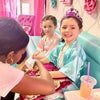 Two young girls in a spa party bus for a girls birthday party in Atlanta.