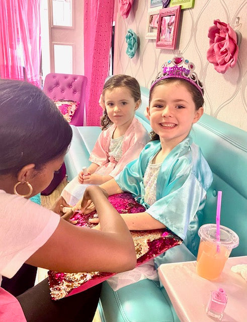 Two young girls in a spa party bus for a girls birthday party in Atlanta.