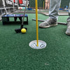 Mobile putt putt golf scene with a yellow ball and club on a green putting surface at a party in Atlanta GA | Confetti Jar