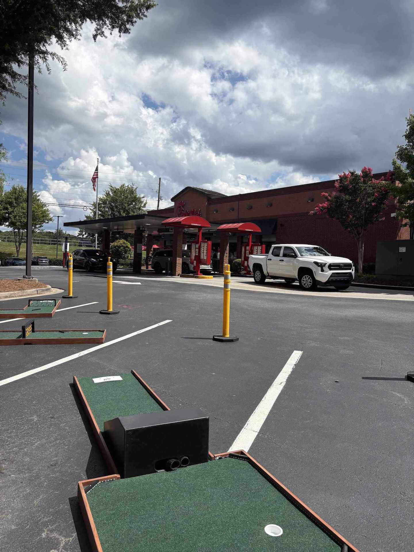 Mobile mini golf set up in a Chick Fil A parking lot for an event in Atlanta GA | Confetti Jar