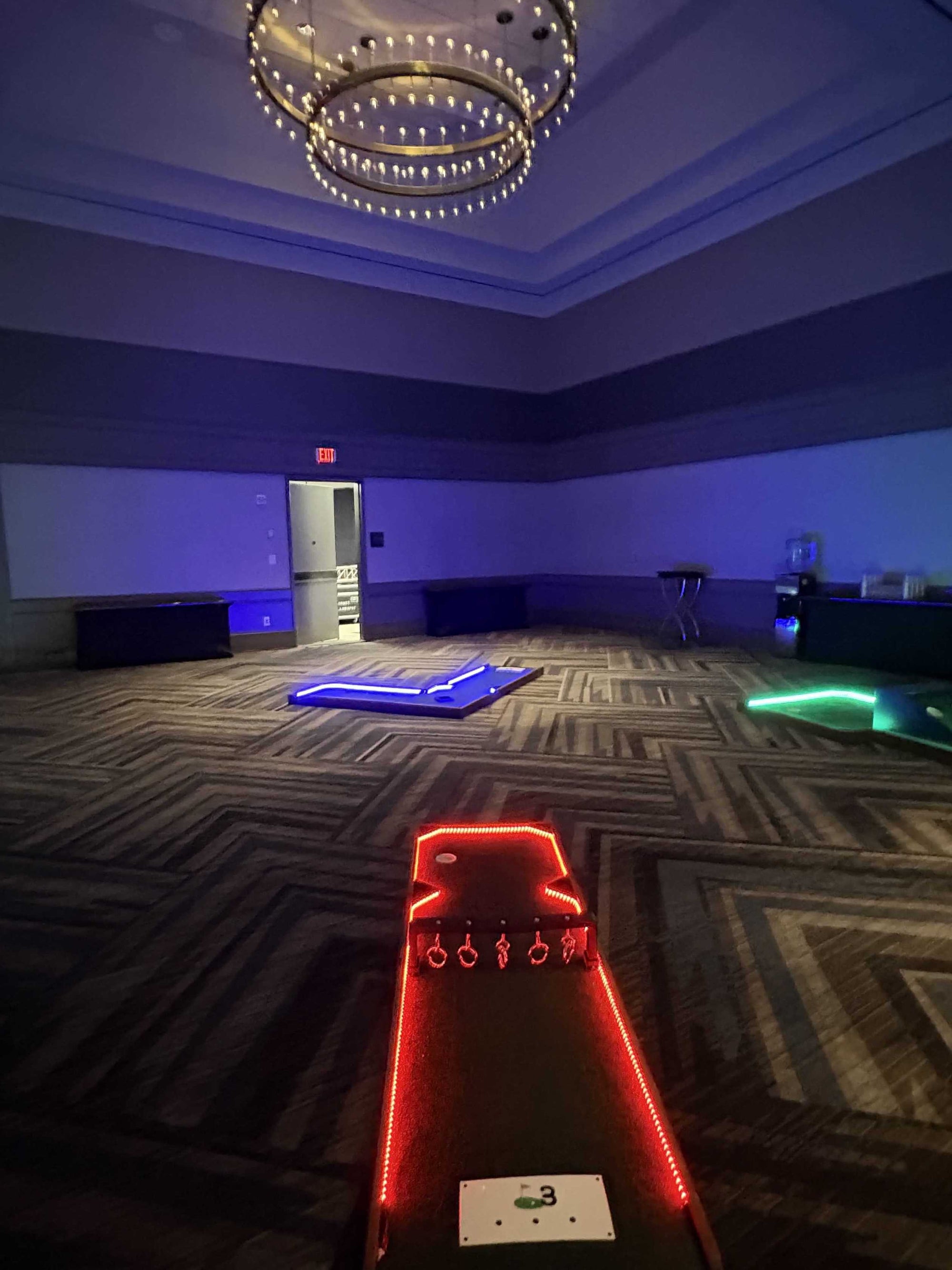Mini golf course lined with LED lights for event rentals in Atlanta GA | Confetti Jar