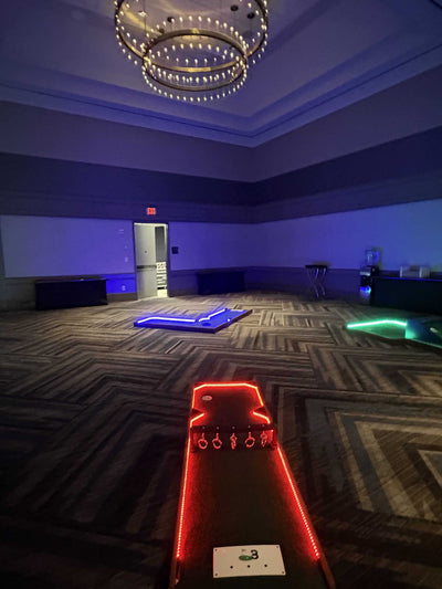 Mini golf course lined with LED lights for event rentals in Atlanta GA | Confetti Jar
