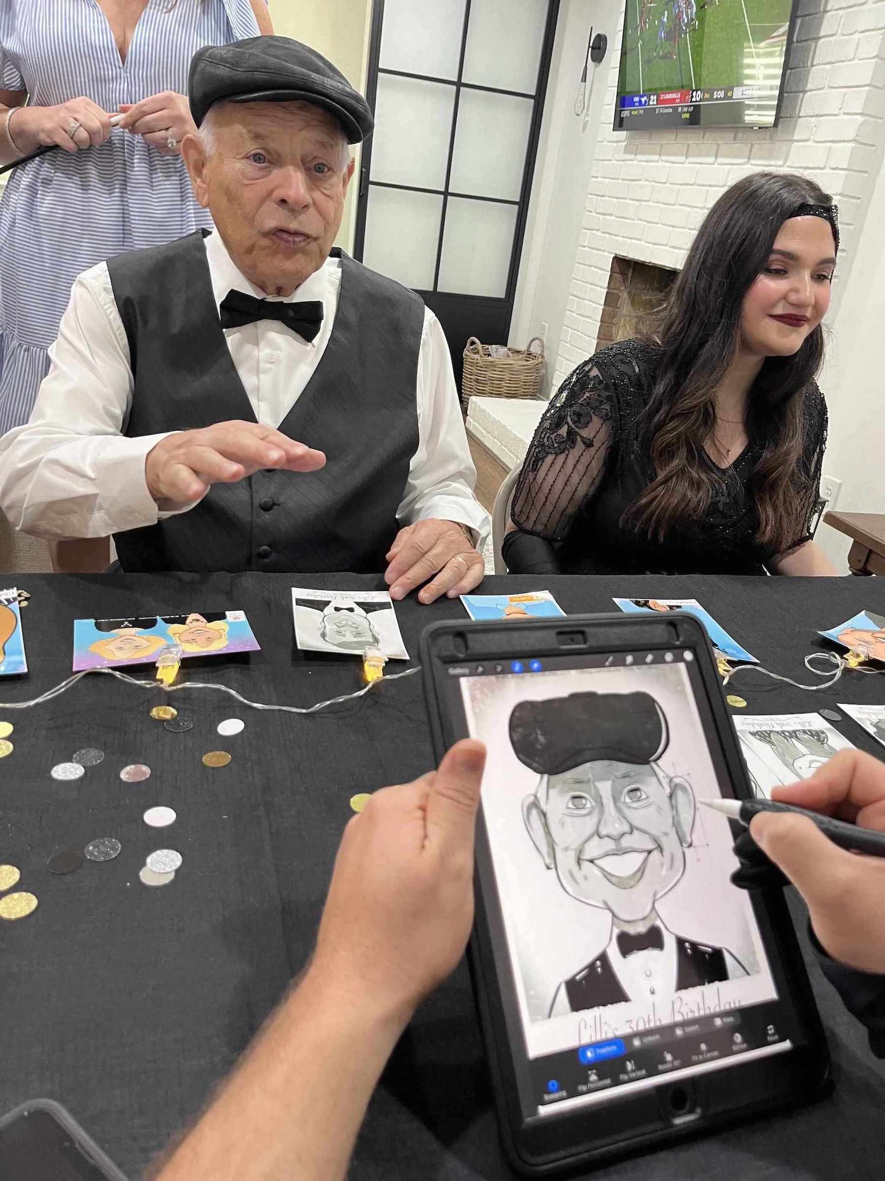 Person drawing digital caricatures of a man and woman at an event  in Atlanta.