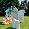 Decorative arch with balloons and personalized name display outdoors at a birthday party in Atlanta.