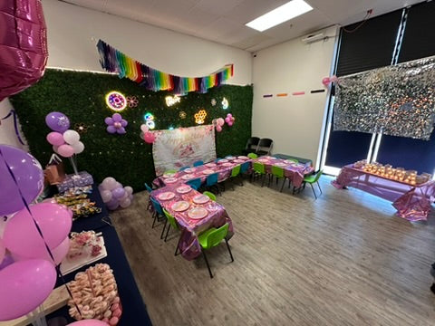 Children's party setup with tables, balloons, and decorations at a birthday party for kids in Atlanta | Confetti Jar